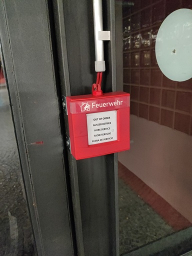 fire alarm with text on it, out of order